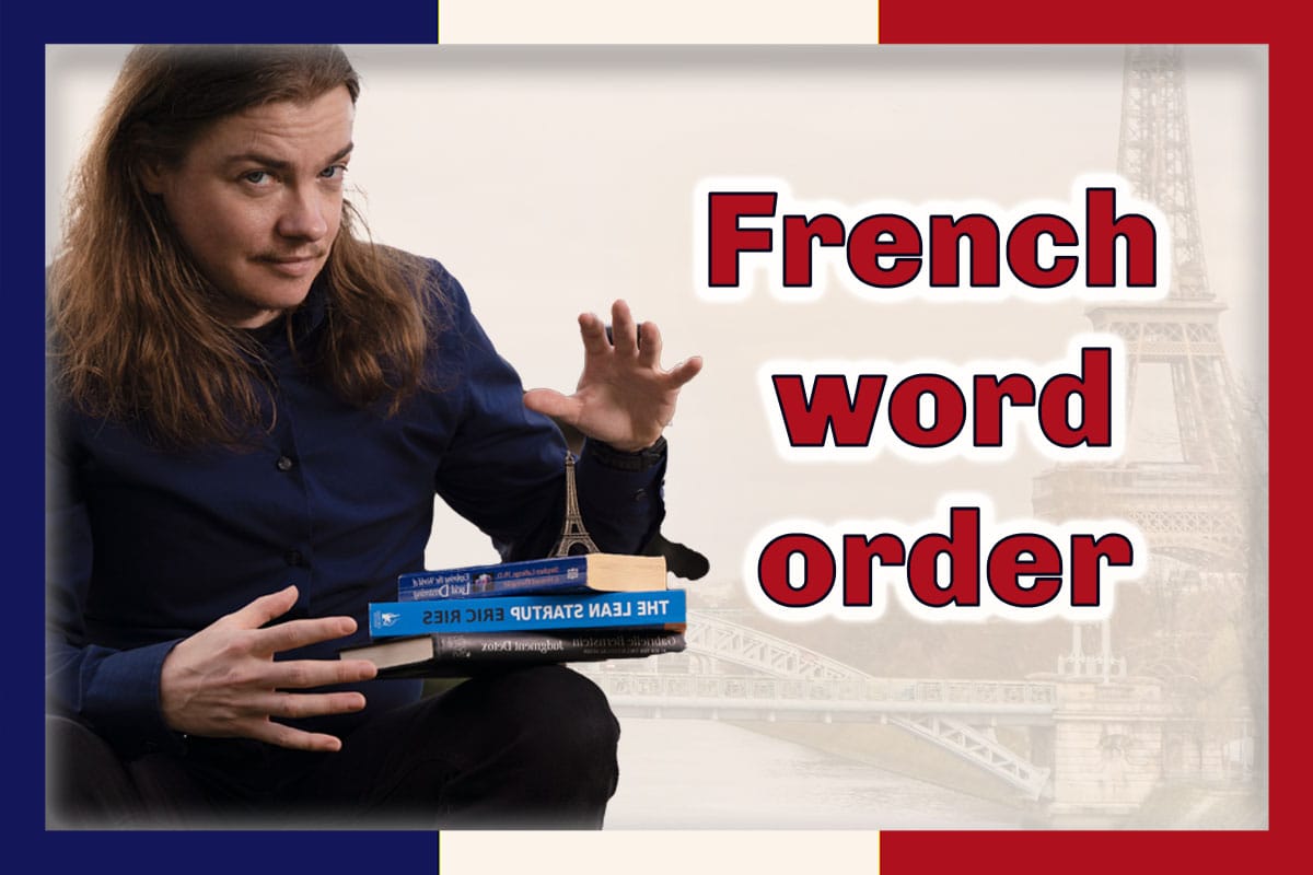 Angel Pretot sits looking at the camera with three books and a toy Eiffel Tower balanced on his lap. The words French word order in red outlined in white at right